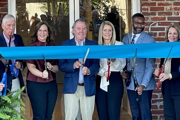 Chairman Phillip McWane celebrates Jimmie Hale Mission's dormitory renovation after donating kickstarter funds